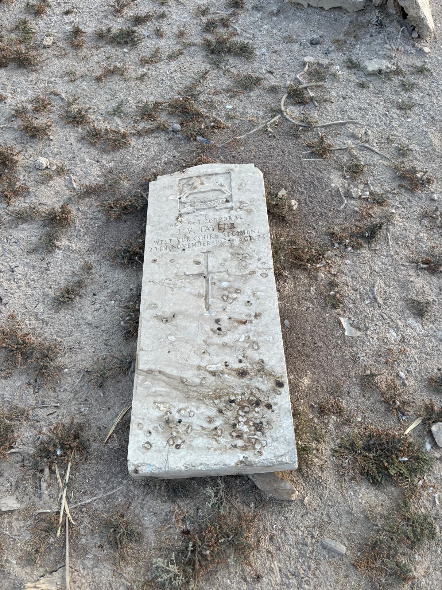 4524967 Corporal J. V. Taylor, West Yorkshire Regiment, 20 November 1925 aged 23. The headstone lies face-up and detached from its grave.