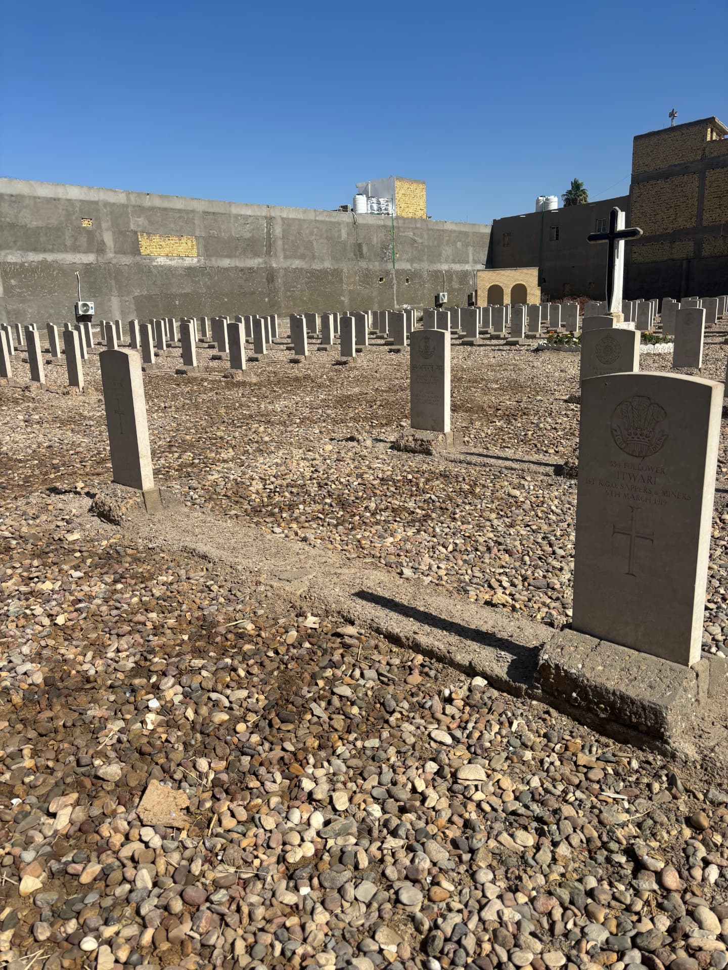 The grave of 534 Follower Itwari, 1st K.G.O. Sappers and Miners, died 5 March 1917, alongside other Indian graves. Many of the concrete bases installed during the renovation are already crumbling.