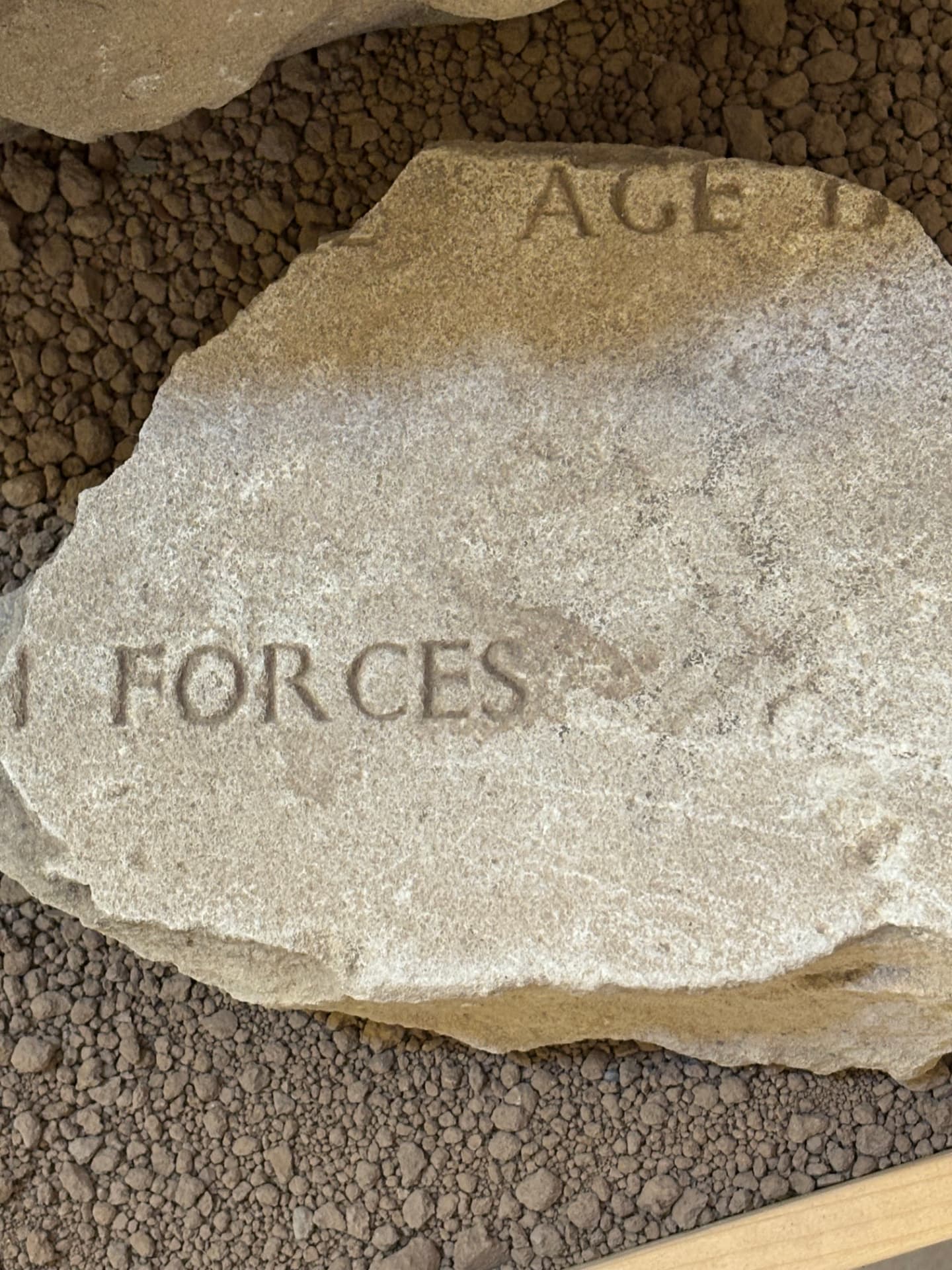 A fragment reading FORCES, from the standard inscription used on the graves of the Polish forces buried at Khanaqin.