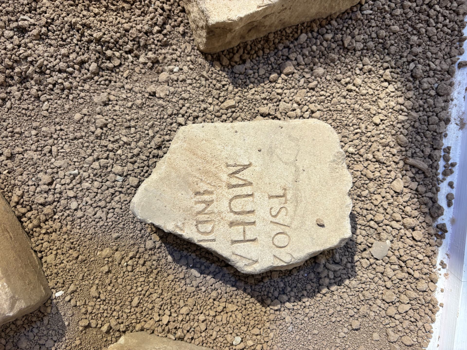 A fragment with a Muhammadan inscription, evidence of the range of faiths represented among the burials at Khanaqin.