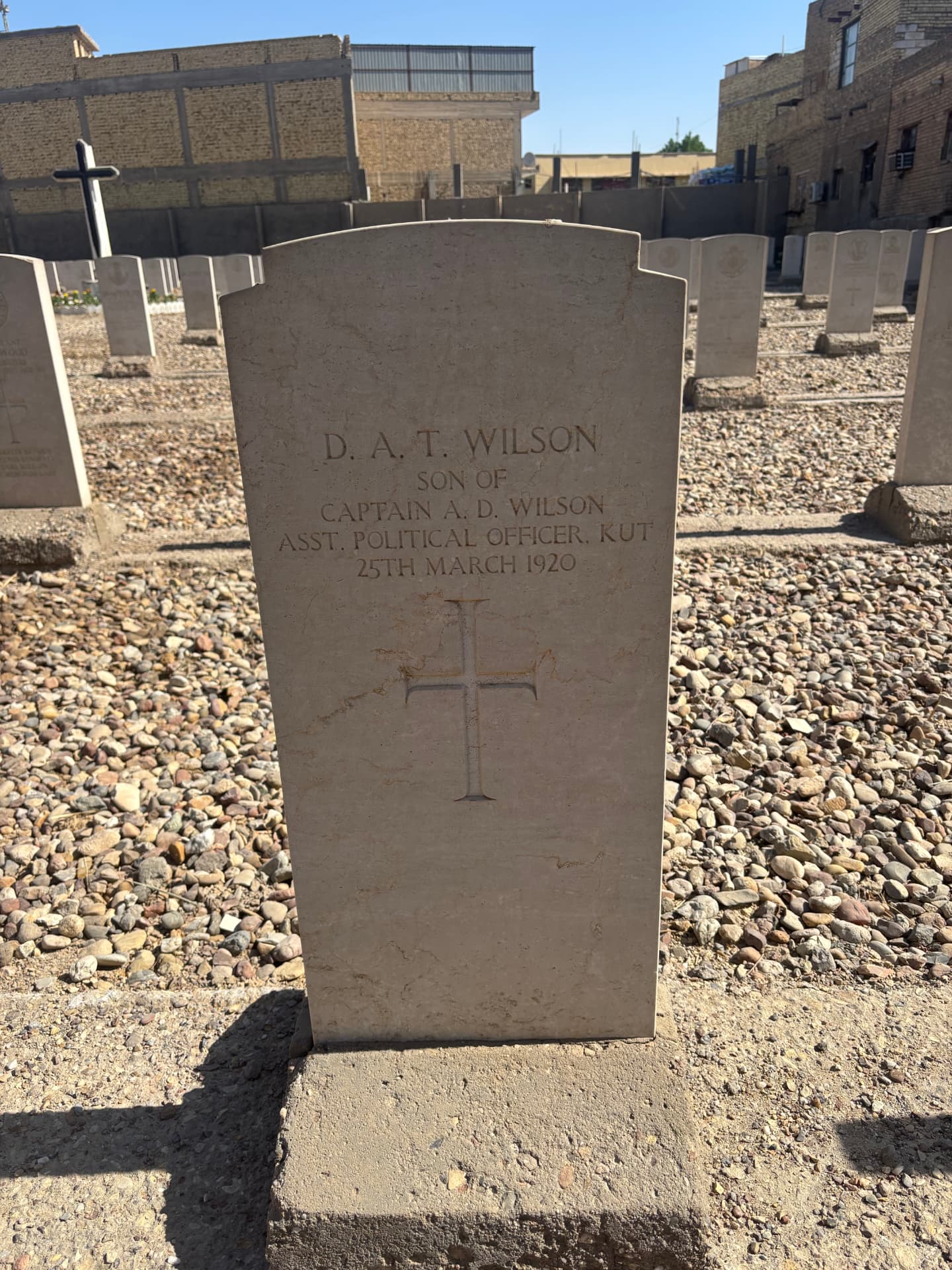 The headstone of D. A. T. Wilson, son of Captain A. D. Wilson, Assistant Political Officer, Kut, who died on 25 March 1920, one of the non-war burials within the cemetery.