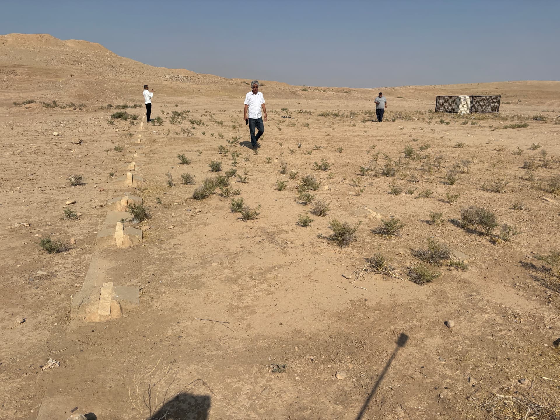 Lines of grave sub-bases running across the site. The headstones were removed when the CWGC abandoned the cemetery in 1965, but the layout of the graves is still clearly readable on the ground.