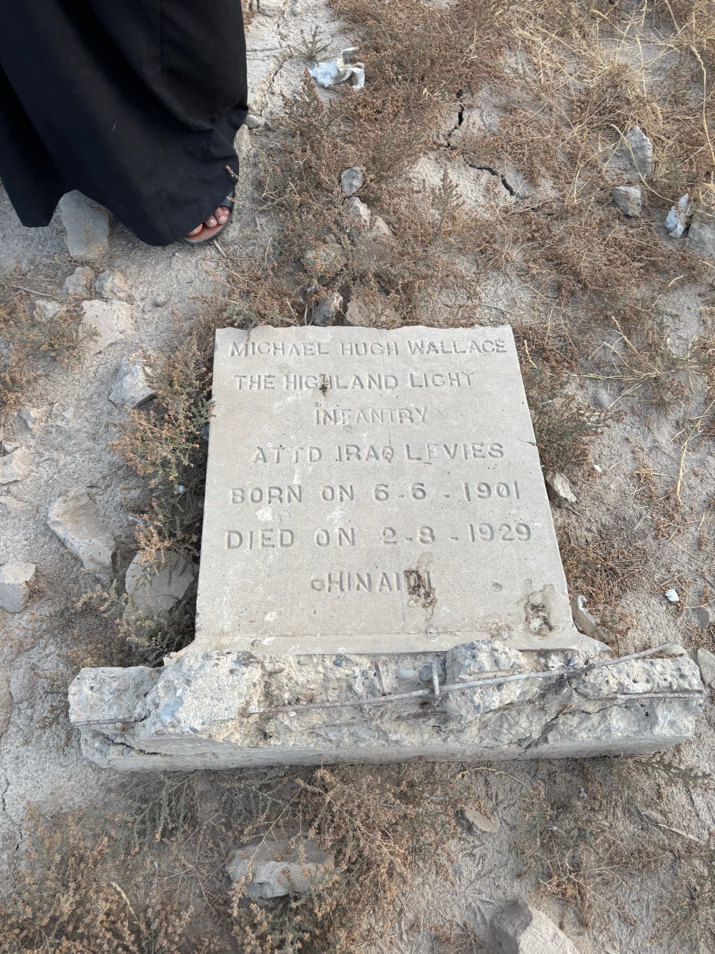 Michael Hugh Wallace, The Highland Light Infantry, attached Iraq Levies, born 6 June 1901, died 2 August 1929, Hinaidi. The stone rests on a shattered kerb with exposed reinforcing bar.