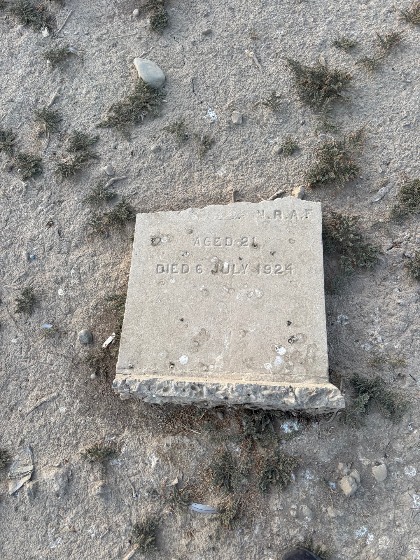 A Royal Air Force headstone worn almost blank, only "aged 21, died 6 July 1924" still legible.