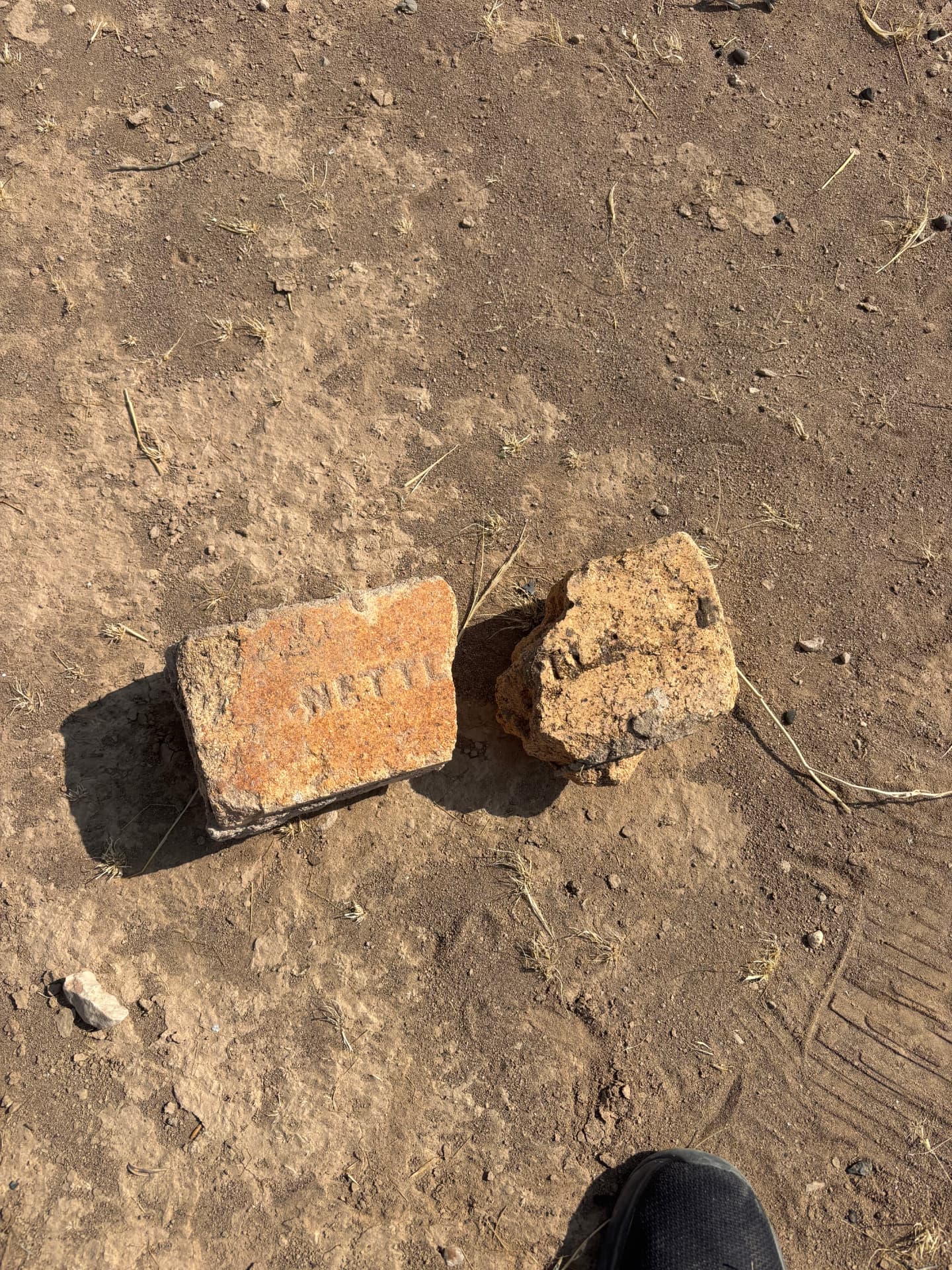 Fragments of grave stones lying on the surface of the site. Further fragments are held in the collection of the local museum along with historical pictures of the camp.