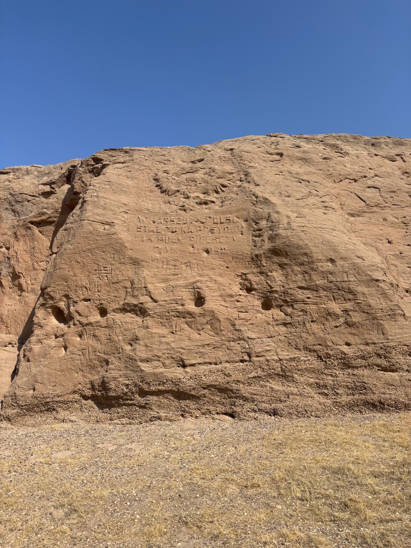 The rock face by the old Polish camp, a few kilometres from the cemetery, carved by soldiers of the Anders' Army who passed through Khanaqin in 1942 and 1943.