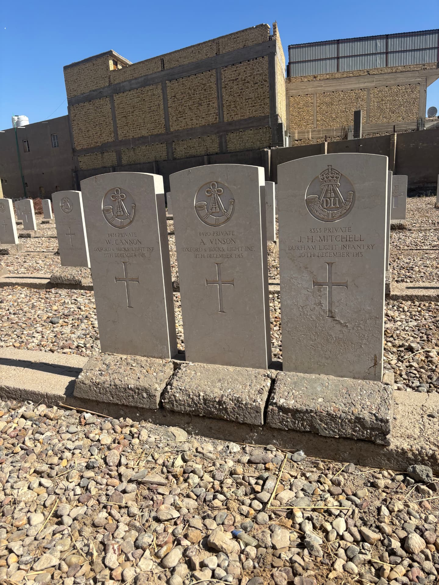 The graves of 8438 Private W. Cannon and 8420 Private A. Vinson, Oxfordshire and Buckinghamshire Light Infantry, both died 11 December 1915, beside 8353 Private J. H. Mitchell, Durham Light Infantry, died 10 December 1915.