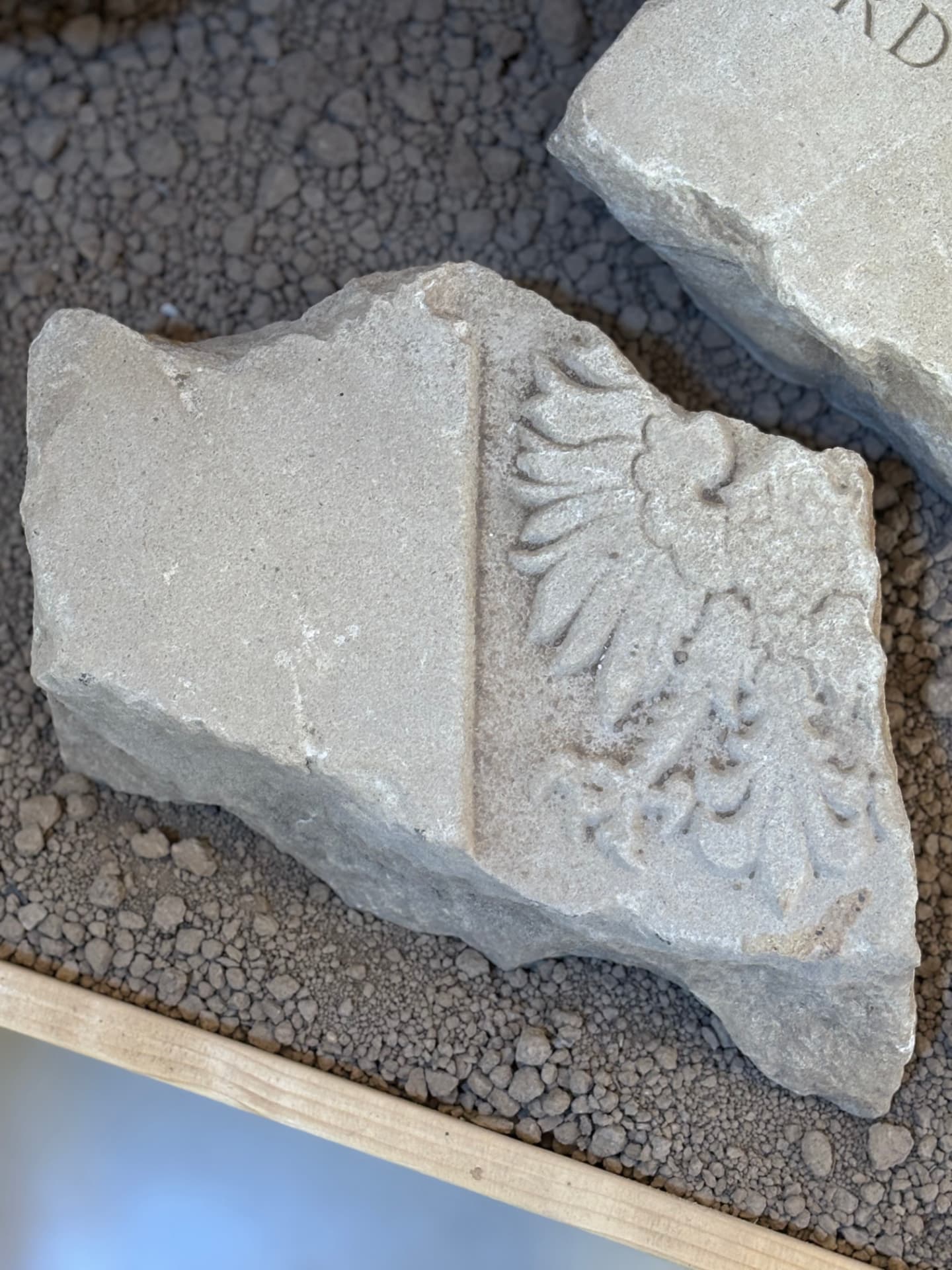 A fragment carrying the Polish eagle, cut into the head of a Polish soldier's grave stone.