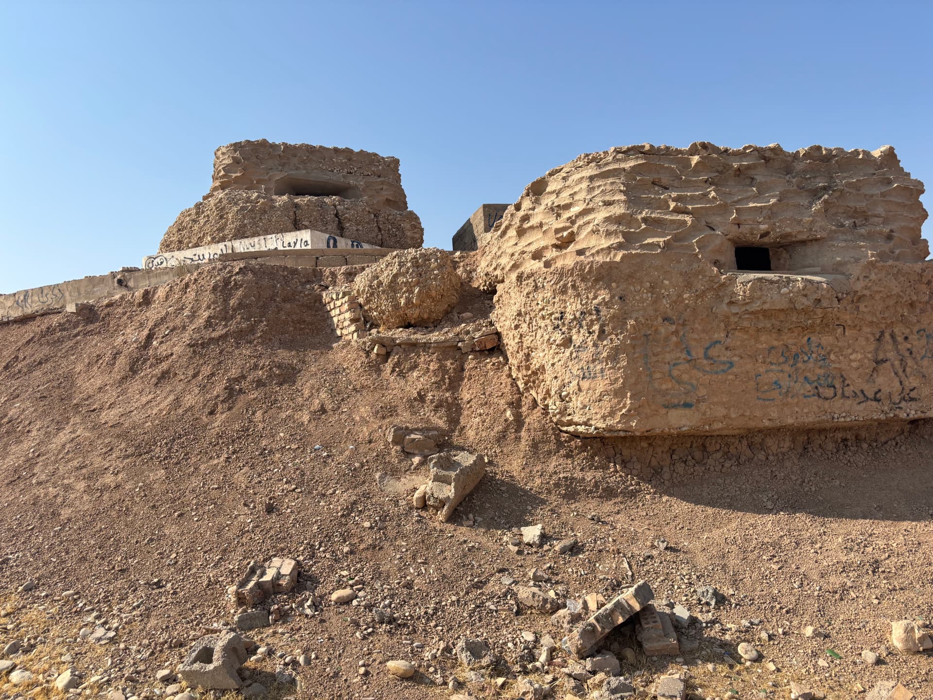Ruins near the cemetery. The site and the former town beside it were heavily damaged during the Iran-Iraq war.
