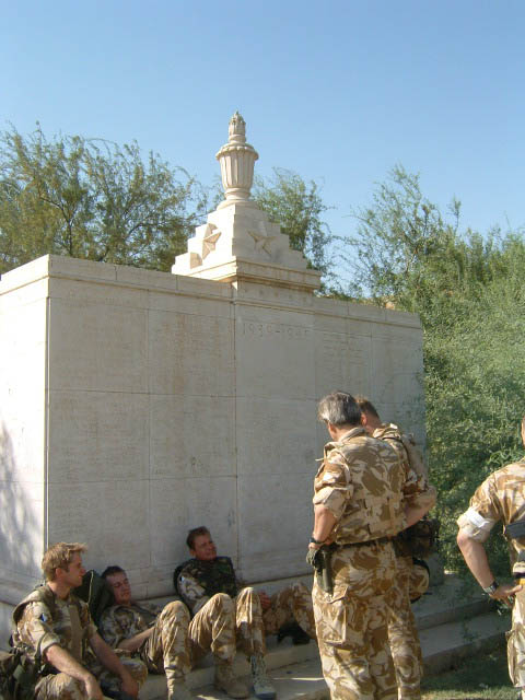 British soldiers resting at the Cremation Memorial, 2003.