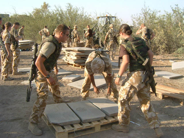 WW2 grave stones being loaded onto pallets prior to removal.