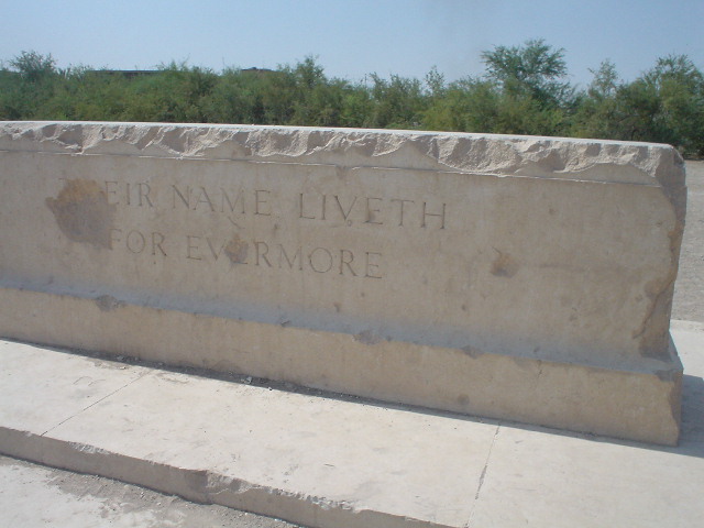 The Stone of Remembrance at Basra War Cemetery in 2003, photographed close up with the inscription visible across the face of the stone.