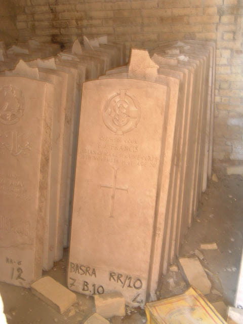 Replacement WW2 Indian gravestones stored in the building beside the Cremation Memorial, marked "BASRA RR/10" and "Z B.10". The headstones, including one bearing a cross and inscribed to an Indian General Service Corps casualty, were later removed by the British Army in 2003 and their current whereabouts are unknown.